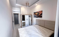 Apartment 1+1 in a new building with furniture and appliances in Mahmutlar-id-8966-photo-12