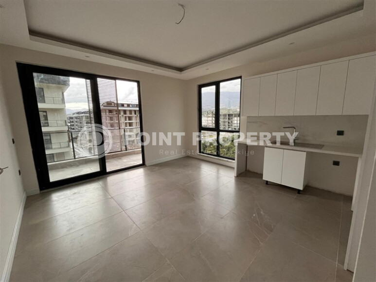 Новый проект в Каргыджаке от надежной строительной компании всего в 280 метрах от известного пляжа. 56-143 кв.м.-id-1207-фото-33