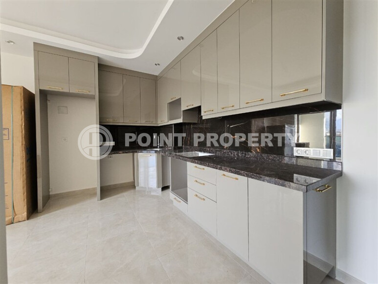 Современная квартира 1+1 с площадью 58 м² в Махмутларе-id-9172-фото-2