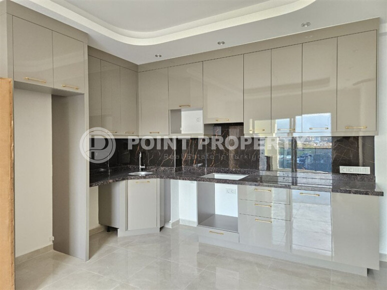 Современная квартира 1+1 с площадью 58 м² в Махмутларе-id-9172-фото-3