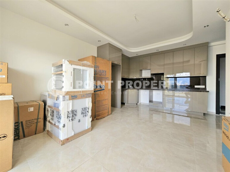 Современная квартира 1+1 с площадью 58 м² в Махмутларе-id-9172-фото-4