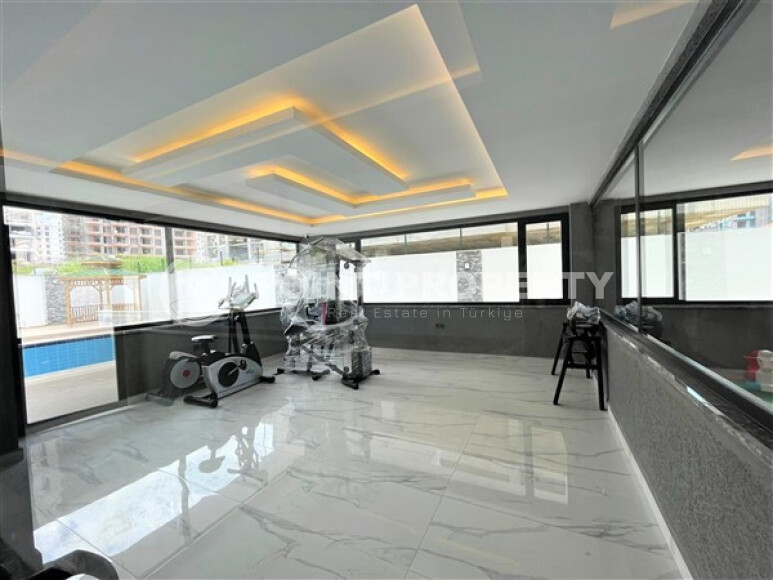 Современные апартаменты в Махмутларе с мебелью и техникой 55 кв.м.-id-9203-фото-8