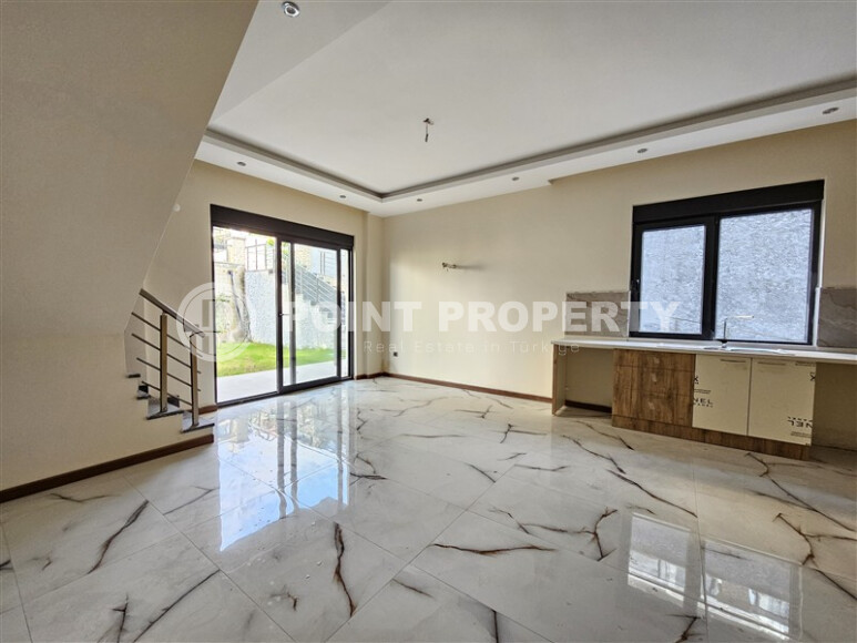 Просторный дублекс с личным садом  в новом доме в тихом районе Хасбахче-id-9205-фото-2