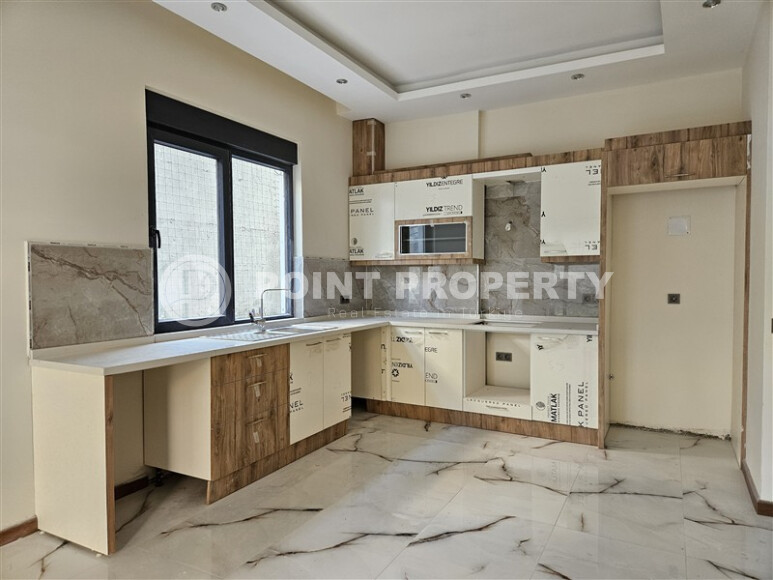 Просторный дублекс с личным садом  в новом доме в тихом районе Хасбахче-id-9205-фото-4