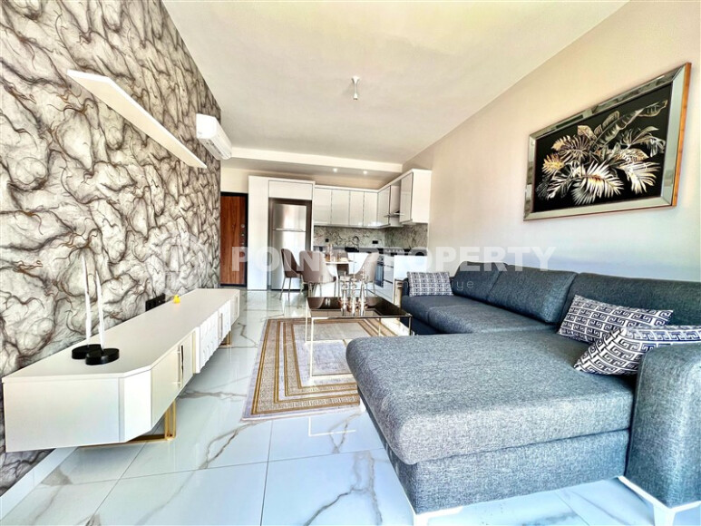 Недорогая квартира 1+1 с новой мебелью и дизайнерским ремонтом в районе Каргыджак-id-9220-фото-2