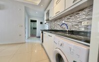 Apartment 1+1 in a complex within walking distance to the sea in Mahmutlar-id-9290-photo-7