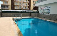 Apartment 1+1 in a complex within walking distance to the sea in Mahmutlar-id-9290-photo-11
