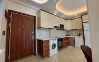 Комфортная квартира 56 м² в престижном комплексе в Махмутларе-id-9357-фото-5