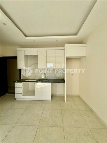 Уютная 1+1 квартира, 55 м² в новом комплексе 2023 года в районе Махмутлар-id-9438-фото-2