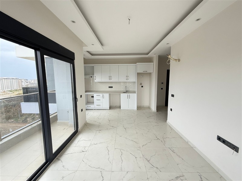 Современная 1+1 квартира, 50 м² в новом комплексе 2024 года в Махмутларе-id-9442-фото-5