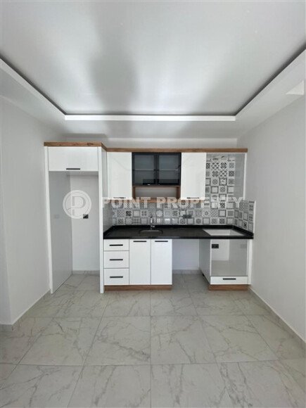 Квартира 1+1 площадью 55 м² в популярном районе Махмутлар-id-9484-фото-3