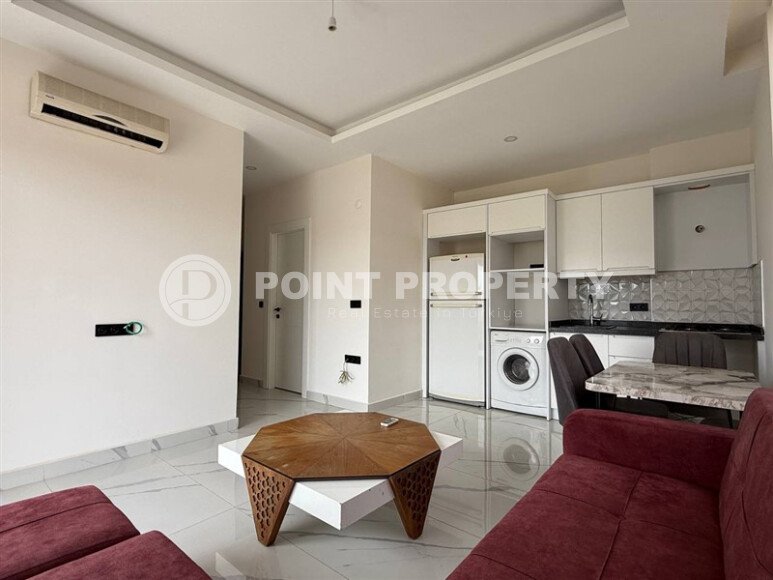 Квартира 1+1 площадью 55 м² в популярном районе Махмутлар, Алания-id-9486-фото-4