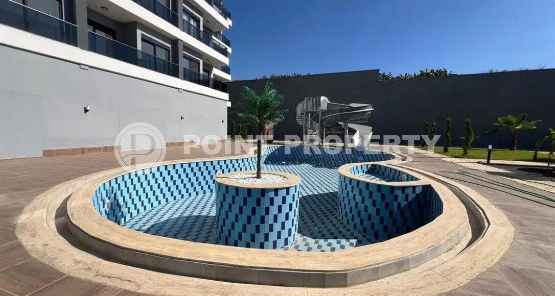 Современная квартира 1+1 в районе Махмутлар, 50 м²-id-9492-фото-11