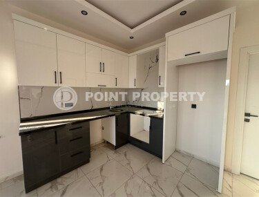 Квартира 1+1 с частичным видом на море в районе Демирташ-id-9498-фото-2