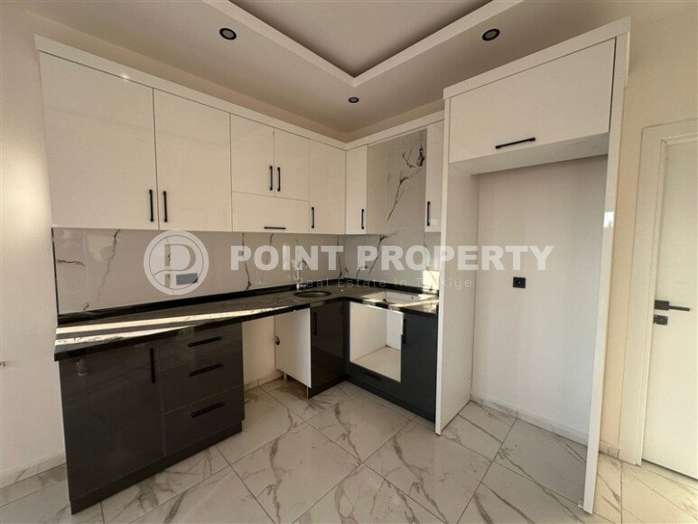 Квартира 1+1 с частичным видом на море в районе Демирташ-id-9498-фото-2