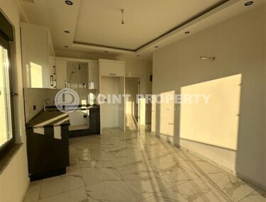 Квартира 1+1 с частичным видом на море в районе Демирташ-id-9498-фото-3