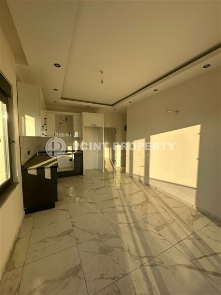 Квартира 1+1 с частичным видом на море в районе Демирташ-id-9498-фото-3