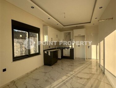 Квартира 1+1 с частичным видом на море в районе Демирташ-id-9498-фото-4