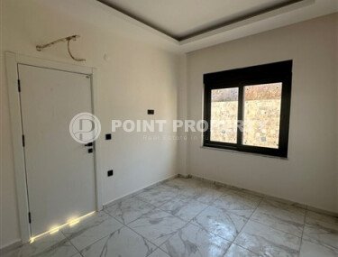 Квартира 1+1 с частичным видом на море в районе Демирташ-id-9498-фото-5