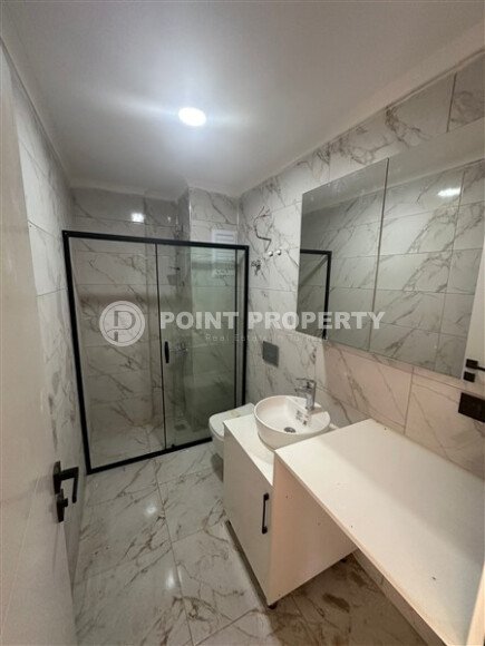 Квартира 1+1 с частичным видом на море в районе Демирташ-id-9498-фото-8