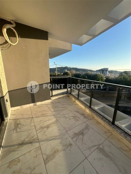 Квартира 1+1 с частичным видом на море в районе Демирташ-id-9498-фото-9