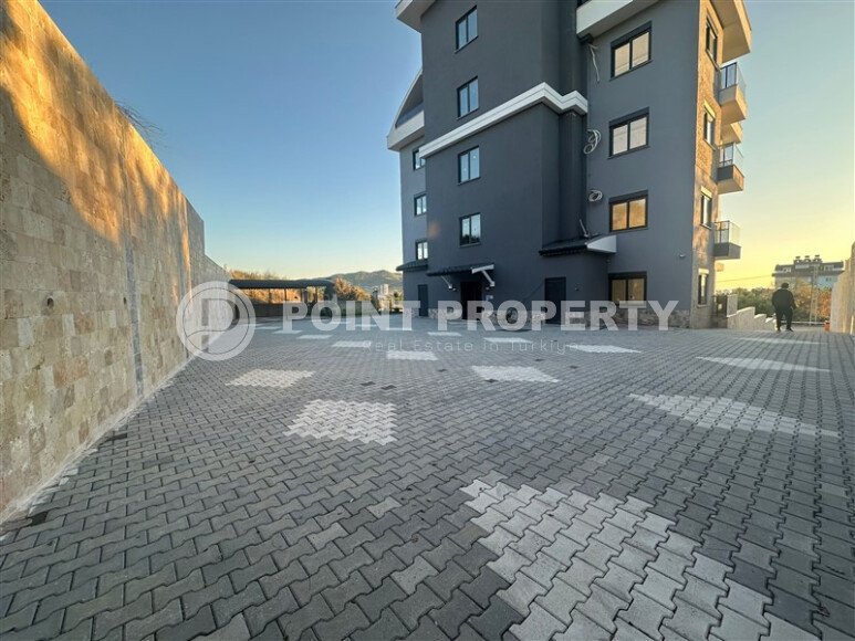 Квартира 1+1 с частичным видом на море в районе Демирташ-id-9498-фото-13