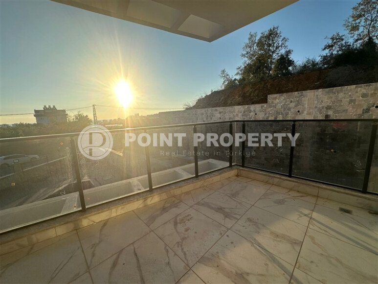 Квартира 1+1 с частичным видом на море в районе Демирташ-id-9498-фото-14