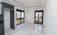 Новая квартира 50 м² на центральной улице в районе Махмутлар-id-9546-фото-2