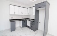 Новая квартира 50 м² на центральной улице в районе Махмутлар-id-9546-фото-4