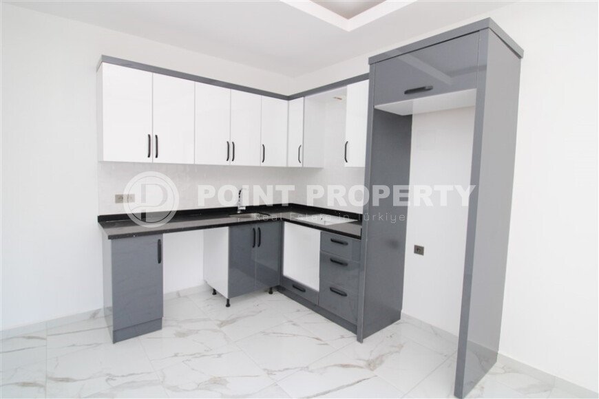 Новая квартира 50 м² на центральной улице в районе Махмутлар-id-9546-фото-4