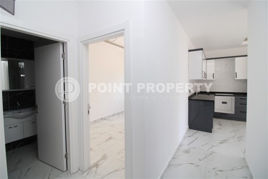 Новая квартира 50 м² на центральной улице в районе Махмутлар-id-9546-фото-8