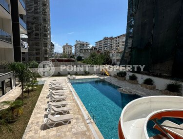 An apartment in a modern residential complex with its own large territory in the Mahmutlar area, equipped with new appliances.-id-9548-photo-1
