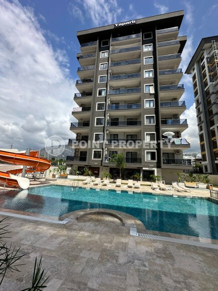 Квартира в современном жилом комплексе со своей большой территорией в районе Махмутлар, укомплектованная новой техникой.-id-9548-фото-2