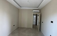 Квартира в современном жилом комплексе со своей большой территорией в районе Махмутлар, укомплектованная новой техникой.-id-9548-фото-9