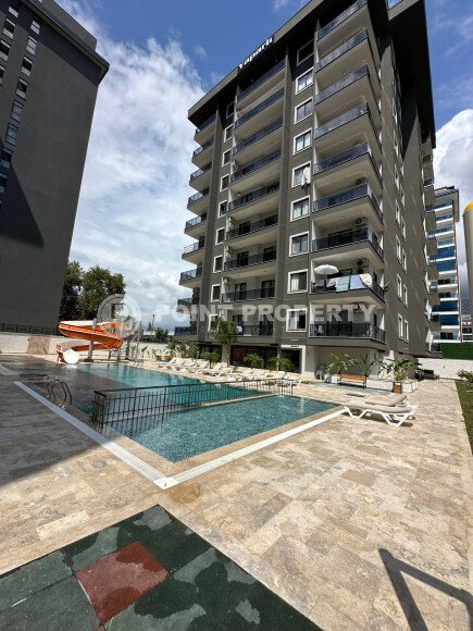 Квартира в современном жилом комплексе со своей большой территорией в районе Махмутлар, укомплектованная новой техникой.-id-9548-фото-12