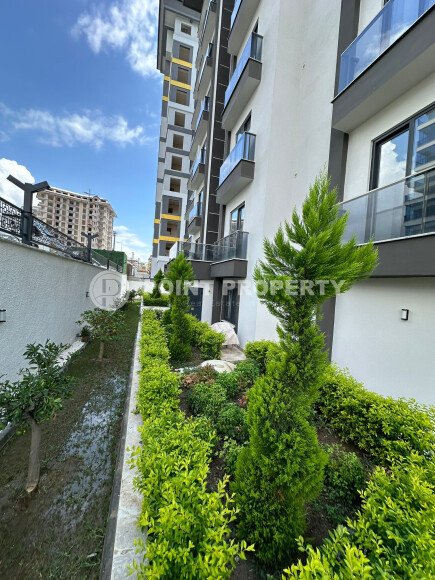 Квартира в современном жилом комплексе со своей большой территорией в районе Махмутлар, укомплектованная новой техникой.-id-9548-фото-14