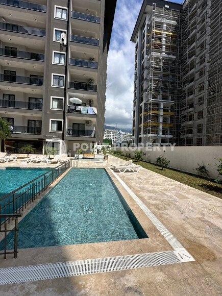 Квартира в современном жилом комплексе со своей большой территорией в районе Махмутлар, укомплектованная новой техникой.-id-9548-фото-25