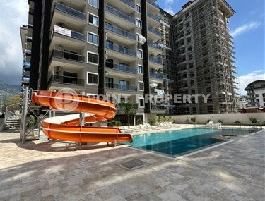 Apartment in a new building with developed infrastructure in the Mahmutlar area, close to the Mediterranean Sea.-id-9549-photo-1