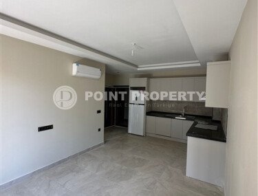 Квартира в новом доме с развитой инфраструктурой в районе Махмутлар, вблизи от средиземного моря.-id-9549-фото-2