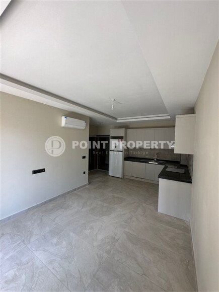 Квартира в новом доме с развитой инфраструктурой в районе Махмутлар, вблизи от средиземного моря.-id-9549-фото-2