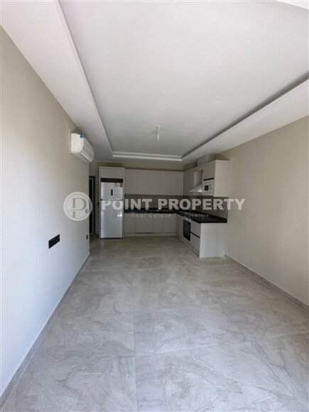 Квартира в новом доме с развитой инфраструктурой в районе Махмутлар, вблизи от средиземного моря.-id-9549-фото-3