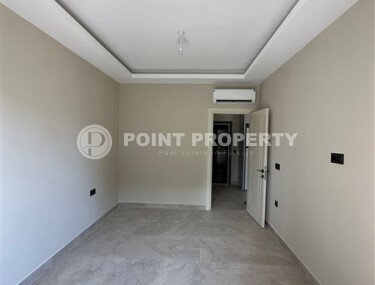 Квартира в новом доме с развитой инфраструктурой в районе Махмутлар, вблизи от средиземного моря.-id-9549-фото-4