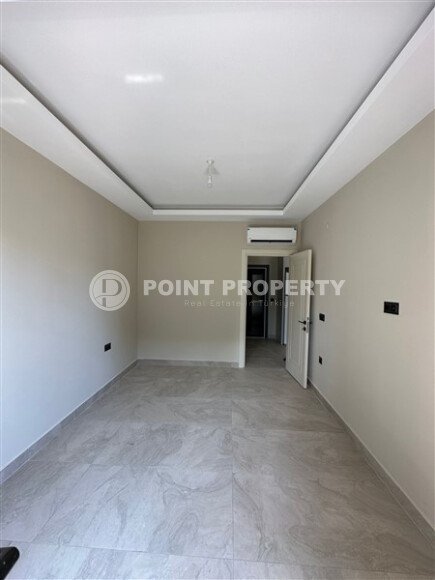 Квартира в новом доме с развитой инфраструктурой в районе Махмутлар, вблизи от средиземного моря.-id-9549-фото-4