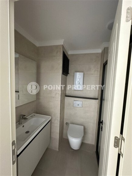 Квартира в новом доме с развитой инфраструктурой в районе Махмутлар, вблизи от средиземного моря.-id-9549-фото-5