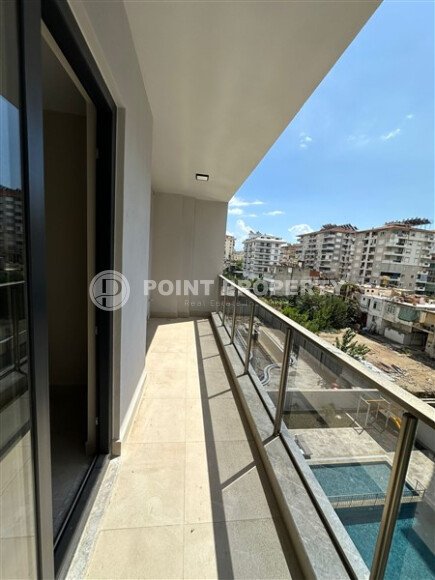 Квартира в новом доме с развитой инфраструктурой в районе Махмутлар, вблизи от средиземного моря.-id-9549-фото-6