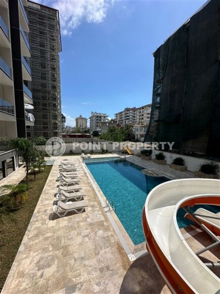 Квартира в новом доме с развитой инфраструктурой в районе Махмутлар, вблизи от средиземного моря.-id-9549-фото-14