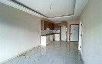 Новая квартира 1+1 площадью 50 м² в районе Оба, Алания-id-9559-фото-3