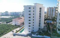 Квартира 1+1 площадью 55 м² с панорамным видом на море в районе Махмутлар-id-9563-фото-6