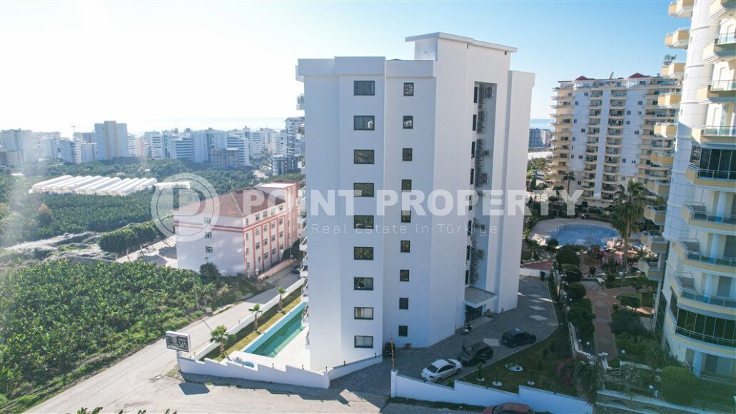 Квартира 1+1 площадью 55 м² с панорамным видом на море в районе Махмутлар-id-9563-фото-6