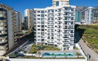 Квартира 1+1 площадью 55 м² с панорамным видом на море в районе Махмутлар-id-9563-фото-7